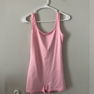 Pink skin tight body suit. Looks big but fits great